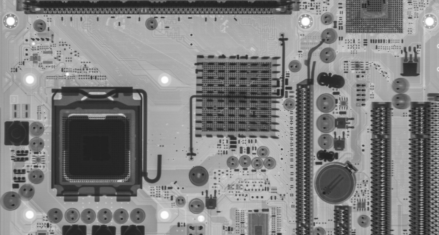 High-resolution X-ray image of a printed circuit board showing internal layer detail