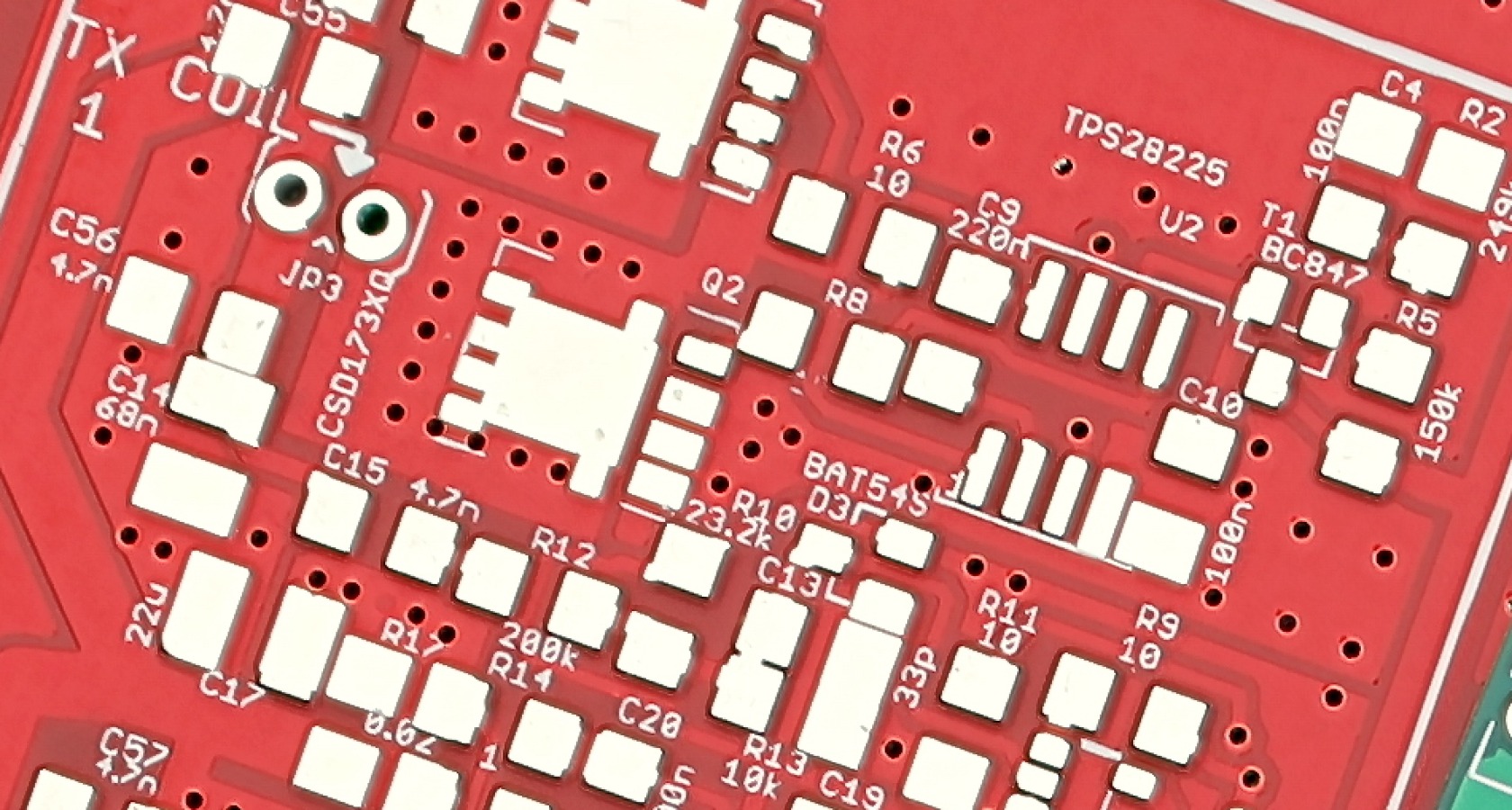 Close-up of a populated automotive-grade printed circuit board with power components