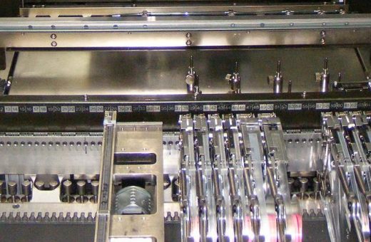 Bank of component tape feeders on a surface-mount assembly line, ready for volume production