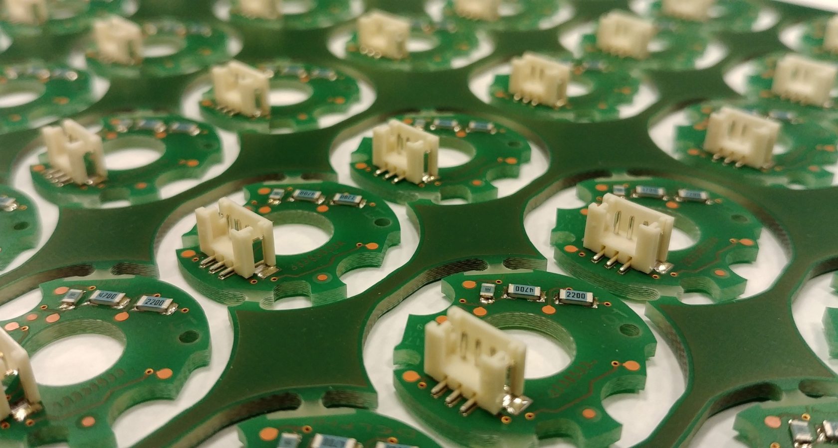Panel of populated printed circuit boards fresh from fabrication and assembly